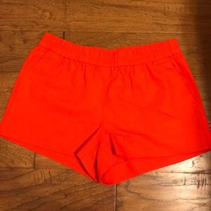 Bright coral red pull on shorts